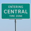 Green roadsign reading "Entering Central Time Zone"