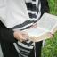 A Jewish man praying with a tallis (prayer shawl).